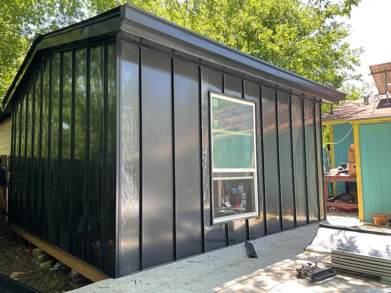 Black standing seam metal wall panels for Roof Inspection in Menasha